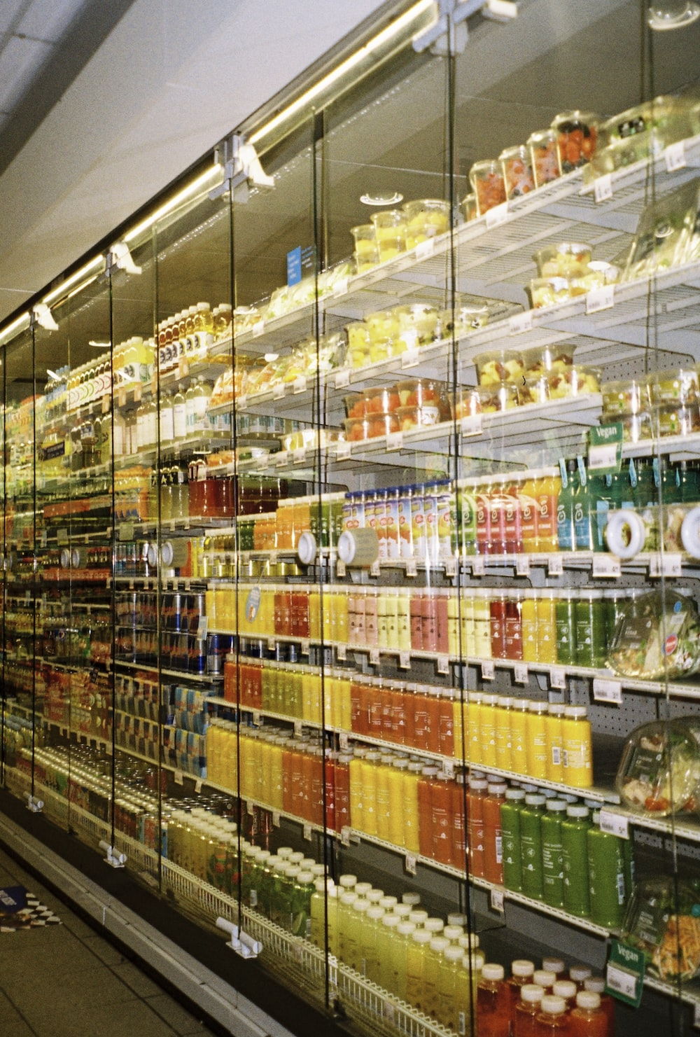 a stocked commercial refrigerator in a supermarket
