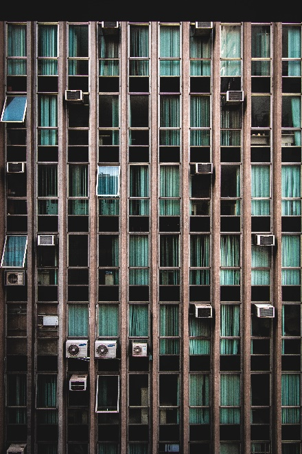  a commercial building with AC units outside