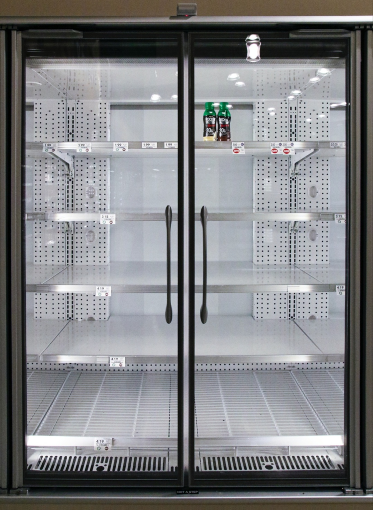 An almost empty commercial refrigerator