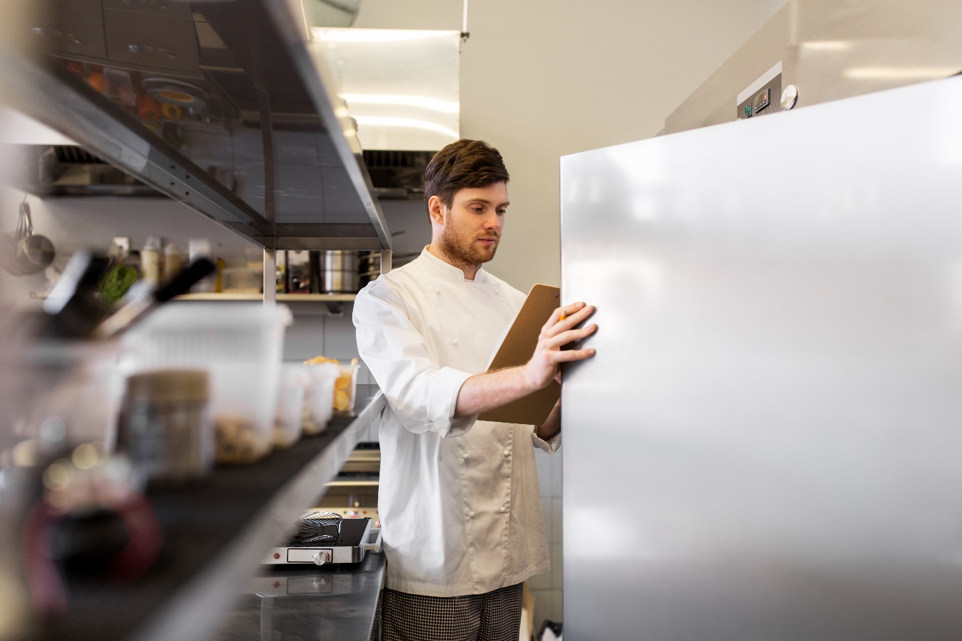 Chef using commercial refrigerator