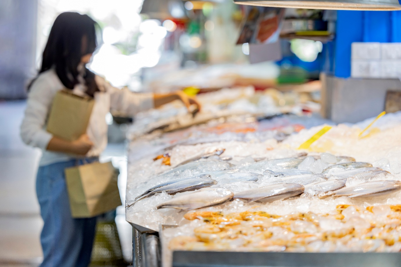 Seafood on a counter filled with ice