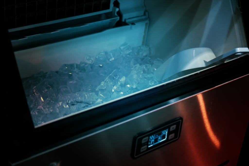 An ice machine making ice cubes