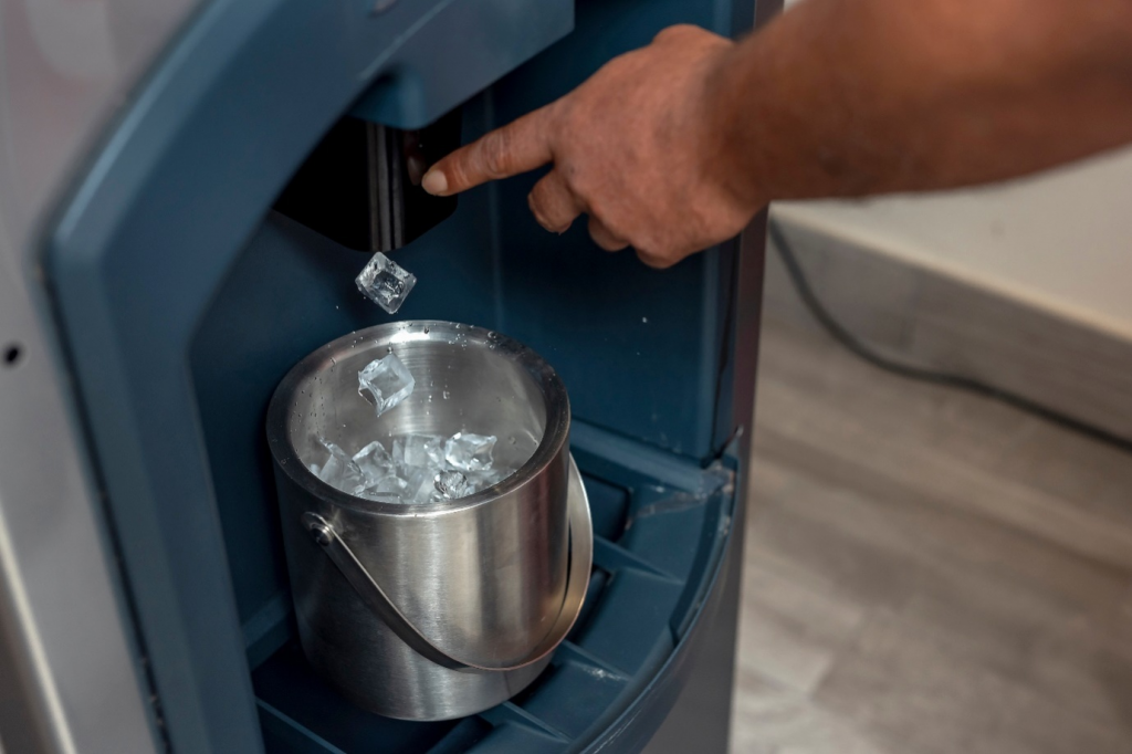 A person taking out ice from a dispenser